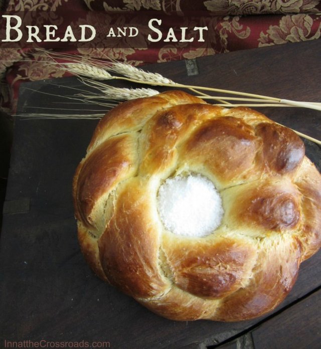 a bread bowl full of salt sits on a table