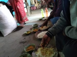 Relishing the lunch at Guru's home