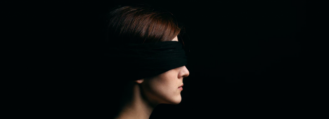 woman wearing a blindfold