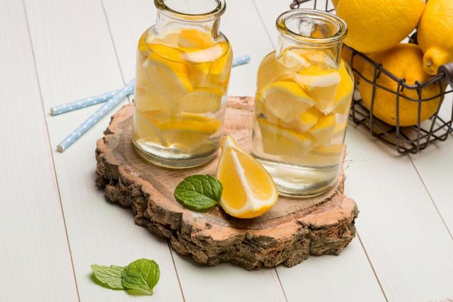 Lemon and lime slices in jars