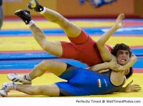 Looks like he has a long neck – When wrestling gets interesting. Its not hard to stretch out on the floor.