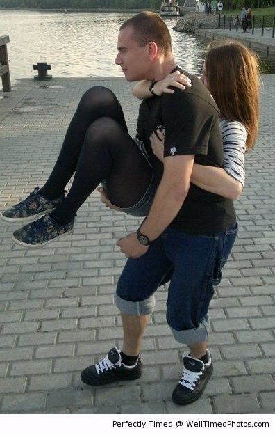 The girl is not carrying her boyfriend – This girl must have a lot of strength to carry him around.