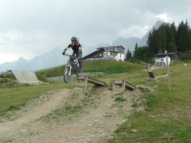 Having fun on a drop-off at the Les Houches BikePark.