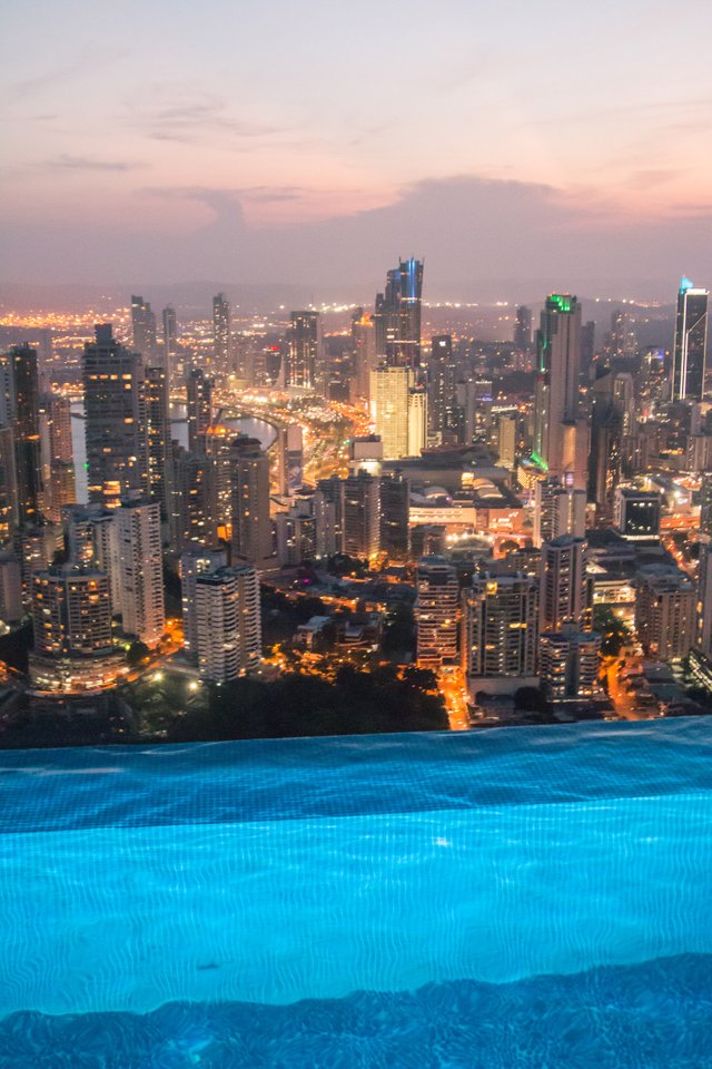 The city lights from the pool