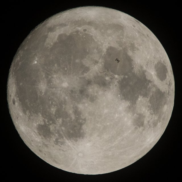 The International Space Station is seen in silhouette as it transits the Moon at roughly five miles per second, Dec. 2, 2017, in Manchester Township, York County, Pennsylvania. Onboard are NASA astronauts Joe Acaba, Mark Vande Hei, and Randy Bresnik; Russian cosmonauts Alexander Misurkin and Sergey Ryanzansky; and ESA astronaut Paolo Nespoli.