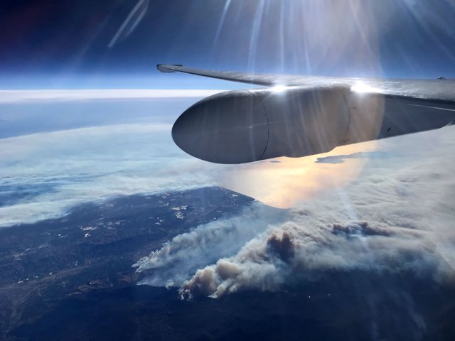 During an engineering flight test of the Cloud-Aerosol Multi-Angle Lidar (CAMAL) instrument, a view from NASA Armstrong Flight Research Center’s ER-2 aircraft shows smoke plumes, from roughly 65,000 feet, produced by the Thomas Fire in Ventura County, California, around 1 p.m. PST on Dec. 5th, 2017.
