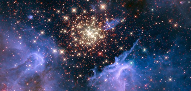 Like a July 4 fireworks display a young, glittering collection of stars looks like an aerial burst.