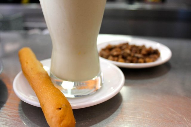 Spanish Horchata de Chufa with a Rosquielleta at Horchatería Alboraya in Madrid