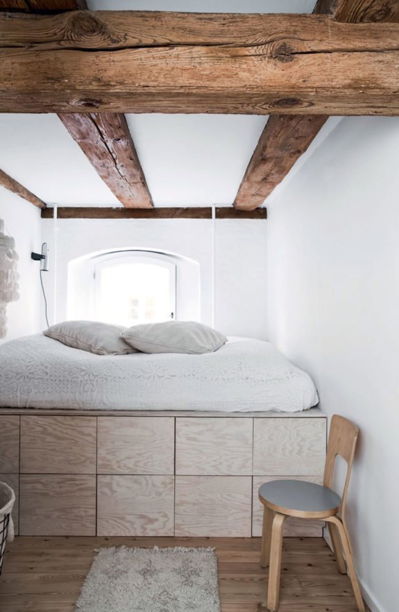 plywood platform bed with simple white bedding. / sfgirlbybay