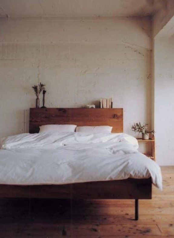 relaxed bedroom decor with simple wood bed frame with white bedding. / sfgirlbybay