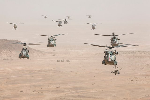 RAF Chinooks take part in the Exercise Saif Sareea 3 firepower demonstration. One is seen carrying a 105mm gun.