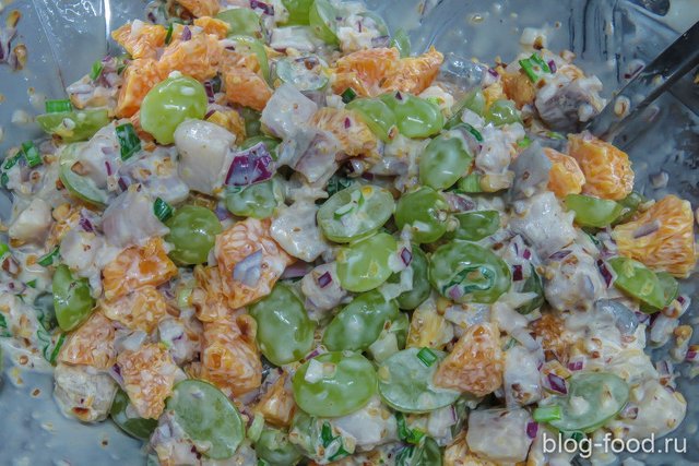 Herring salad with tangerines and grapes