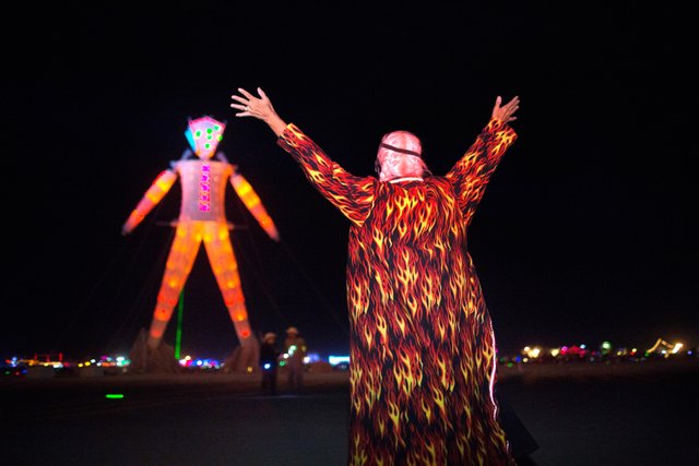 Crimson Rose signals The Man. Image: John Curley, burningman.org. Used without permission for non-commercial, educational, and discussion purposes under the Fair Use provisions of the Digital Millenium Copyright Act