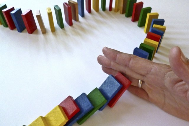 hand play color colorful toy crayon stones fun stop domino games end dominoes sequence barricade interruption play stone steinchen indoor games and sports fall over domino effect chain reaction interrupt