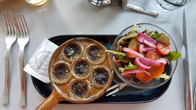 Snails / Escargots. Taken out of their house and drowned in butter pesto.