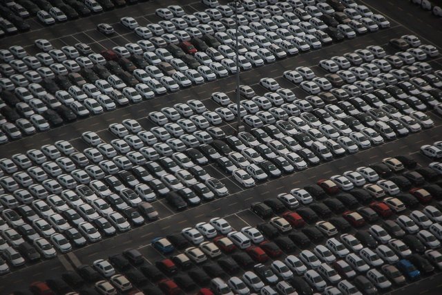 overhead shot of large lot full of cars