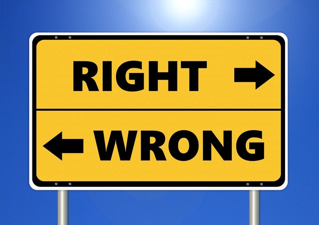 yellow sign pointing to "right" and "wrong"