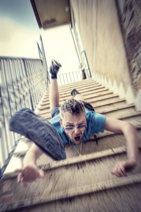 man falling down stairs