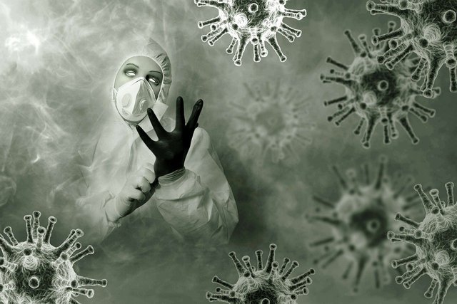 androgynous figure in a mist of viruses, wearing a mask and hazmat suit and putting on gloves
