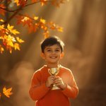 Warm autumn colors, volumetric lighting, visible light beams through dust or fog, earthy and cozy atmosphere, boy receiving an award for a victory.jpg