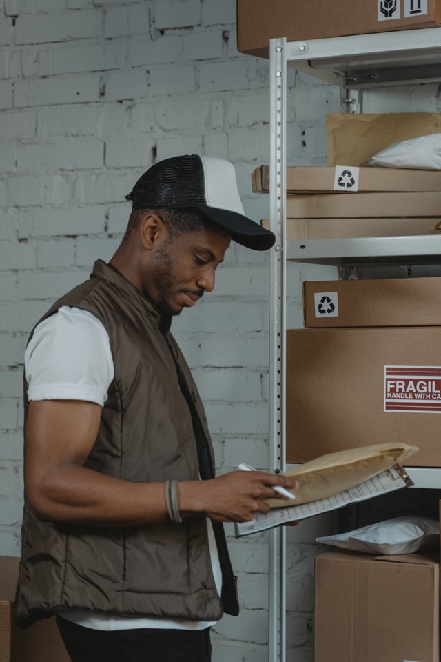 black worker checking stock.jpg