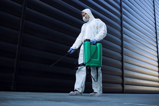 person-white-chemical-protection-suit-doing-disinfection-public-areas-stop-spreading-highly-contagious-corona-virus.jpg