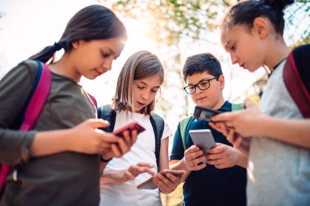 kids-playing-video-games-on-smart-phone-after-school.jpg