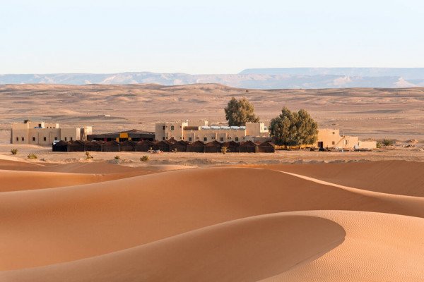 depositphotos_381428410-stock-photo-small-village-sands-sahara-desert.jpg