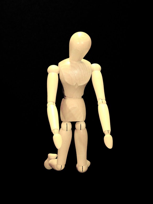 wooden-figure-kneeling.jpg