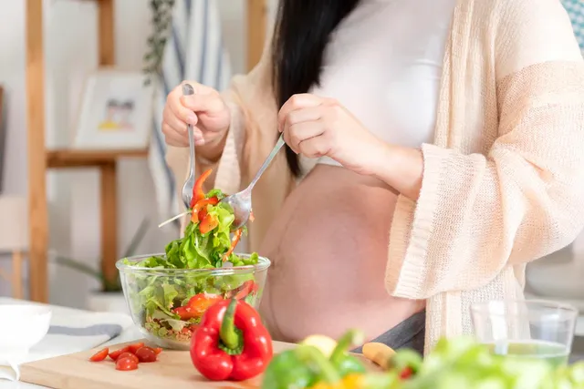 happy-asian-pregnant-woman-cooking-salad-home-doing-fresh-green-salad-eating-many-different-vegetables-during-pregnancy-healthy-pregnancy-concept_74952-2663.webp
