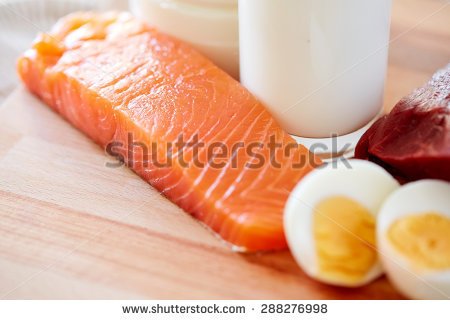 stock-photo-healthy-food-culinary-cooking-and-diet-concept-close-up-of-salmon-fillets-eggs-and-milk-on-288276998.jpg