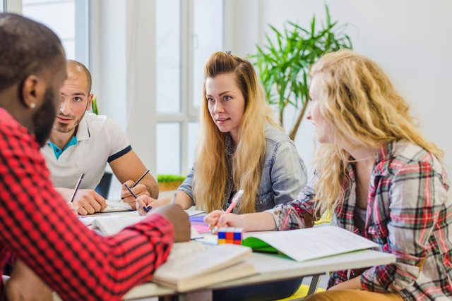 people-with-textbooks-working-together.jpg