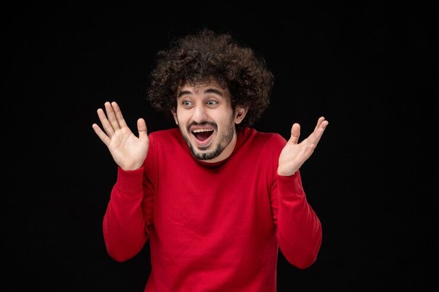 front-view-young-male-red-sweater-black-wall_140725-143043.jpg