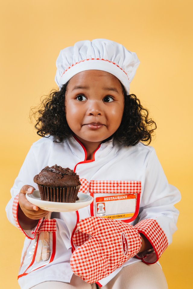 Little girl eating chocolate.jpg