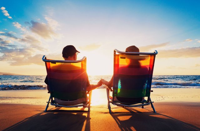 senior-couple-sitting-on-the-beach.jpg