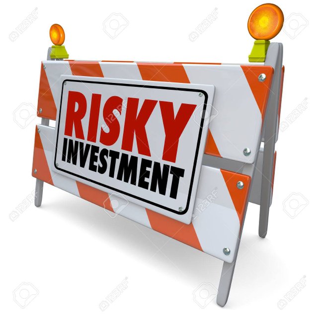 35021202-risky-investment-words-on-a-barrier-or-road-construction-warning-sign-to-illustrate-the-need-for-cau.jpg