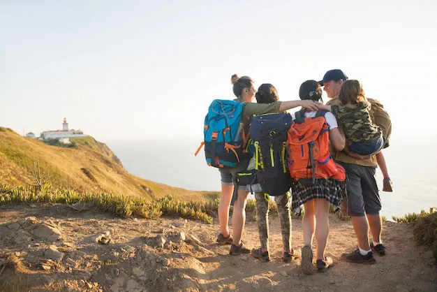 rear-view-happy-hiking-family-embracing_74855-21366.webp