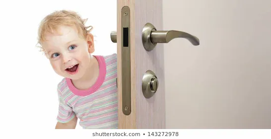 happy-kid-behind-door-260nw-143272978.webp