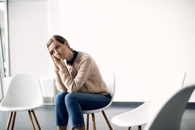 young-pensive-woman-waiting-group-therapy-start.jpg