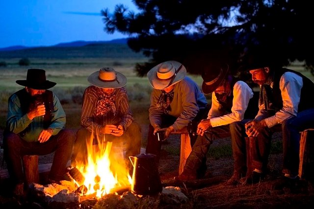 group-of-cowboys-around-a-campfire-richard-wear.jpg