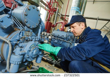 stock-photo-service-engineer-worker-at-industrial-compressor-refrigeration-station-repairing-and-adjusting-237322501.jpg