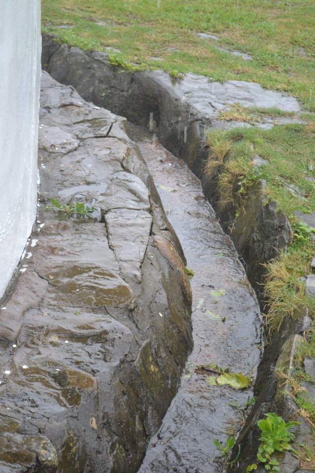 water all flowing into ground water tank.JPG
