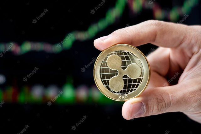 golden-ripple-xrp-cryptocurrency-coin-with-candle-graph-background-crypto-is-digital-money_42256-3636.jpg