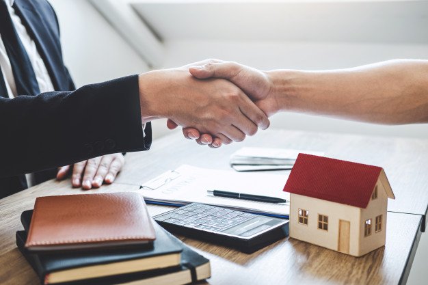 finishing-successful-deal-real-estate-broker-client-shaking-hands-after-signing-contract-approved-application-form-concerning-mortgage-loan-offer-house-insurance_122498-249.jpg