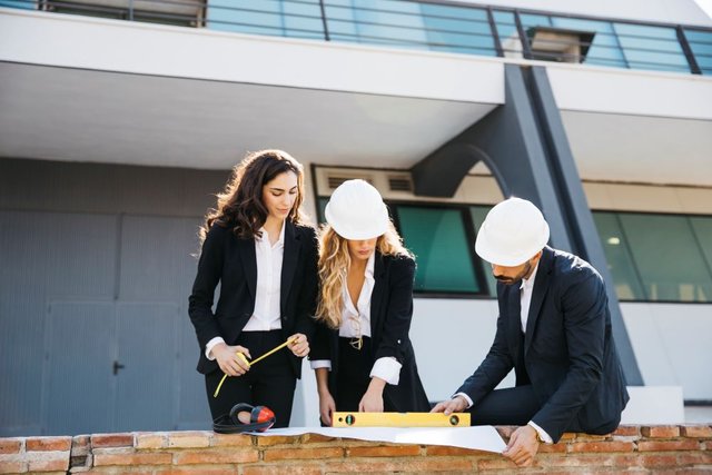 three-architects-wearing-helmets1.jpg