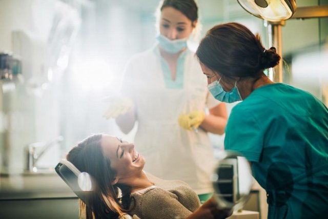 dentists-with-smiling-patient-in-chair-1024x683.jpg