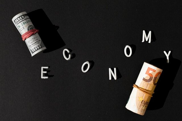 economy-word-rolls-money_23-2148546868.jpg