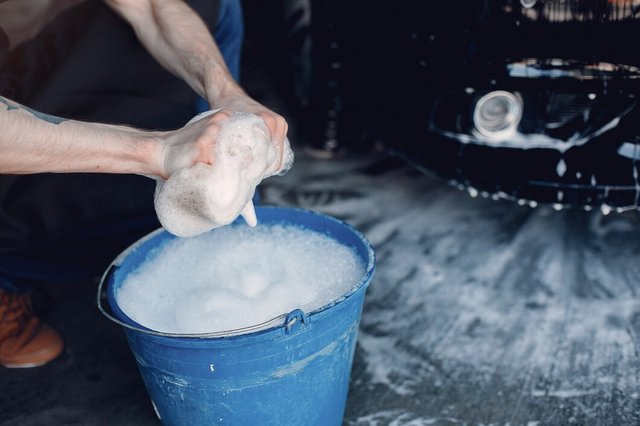 man-washing-his-car-garage_1157-26050.jpg