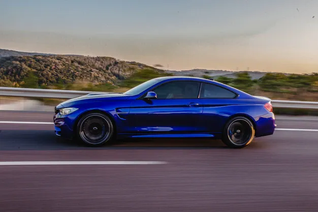 navy-blue-sport-coupe-road-side-view_114579-5046.webp