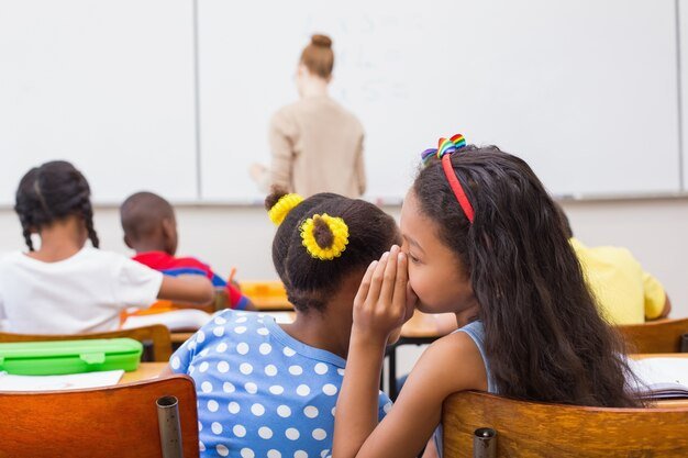 cute-pupils-whispering-classroom_13339-103350.jpg